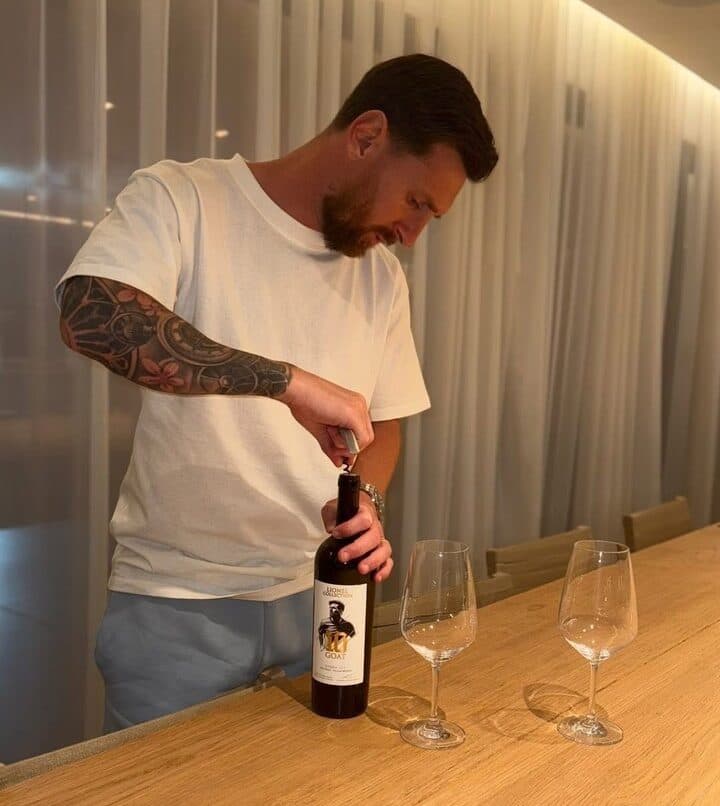 Leo Messi uncorking a bottle of the Lionel Collection